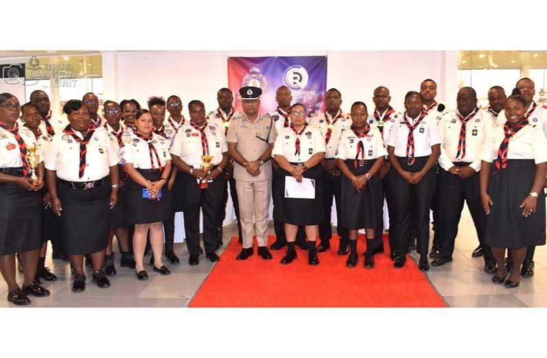 Deputy Commissioner ‘Administration,’Ravindradat Budhram (centre) flanked by Scout Leaders and Regional Community Officers at the Police Officers’ Mess Annexe