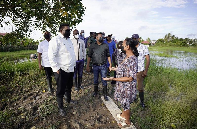 Flashback: President Ali listening to the concerns of a Mahaicony Creek resident