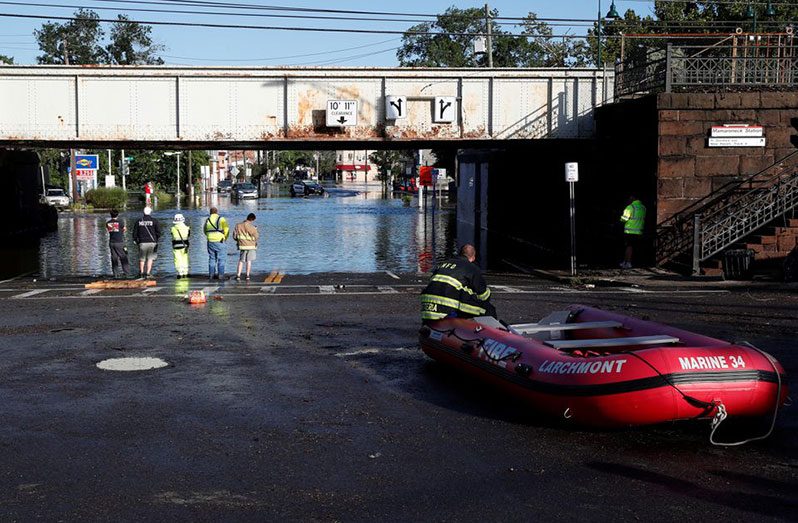 First responders stand by floodwaters to perform rescues of trapped local residents after the remnants of Tropical Storm Ida brought drenching rain, flash floods and tornadoes to parts of the northeast in Mamaroneck, New York, U.S., September 2, 2021 (REUTERS/Mike Segar)