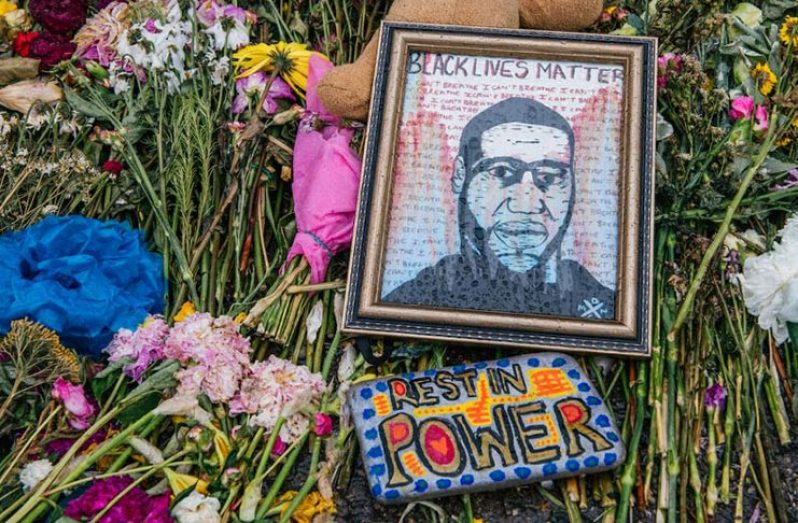 Flowers and messages are placed at the memorial for George Floyd. (Getty Images)