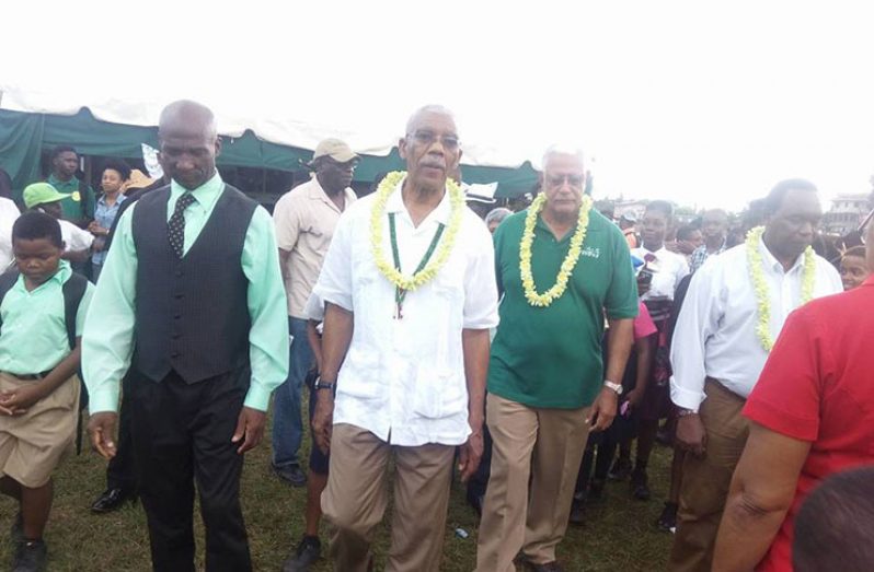 President David Granger accompanied by Minister of Agriculture, Noel Holder, and Regional Vice Chairman, Elroy Adolph, as they view the exhibitions