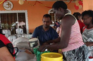 Distribution of food and other items at Parfaite Harmonie