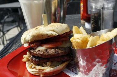 A meal of a ''Monster''-sized A.1. Peppercorn burger, Bottomless Steak Fries, and Monster Salted Caramel Milkshake is seen at a Red Robin restaurant in Foxboro, Massachusetts July 30, 2014.