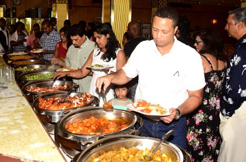 Patrons preparing to tuck in Sunday at the annual GRC food festival at the New Thriving Restaurant on downtown Main Street