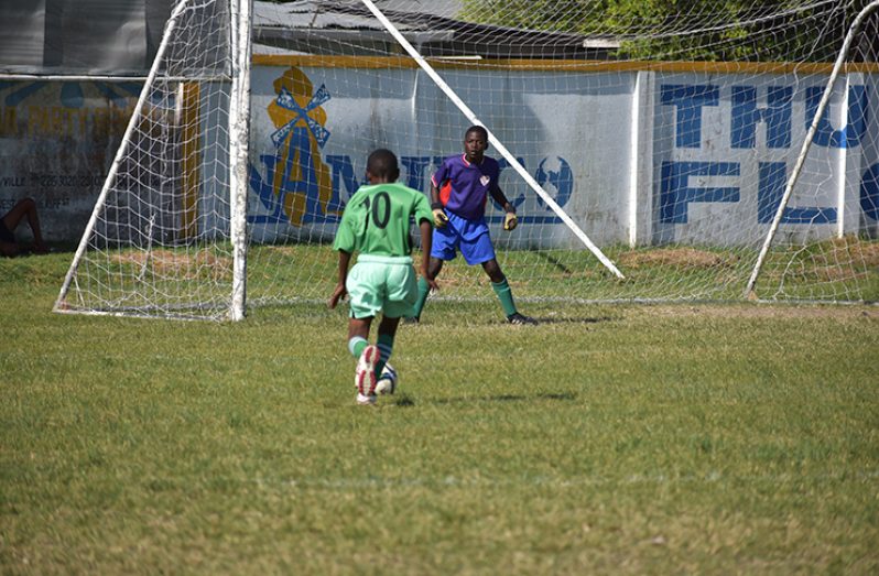 Part of the action in the GFA-IMC leg of the Pele Alumni ‘Frank Watson’ U-15 tournament