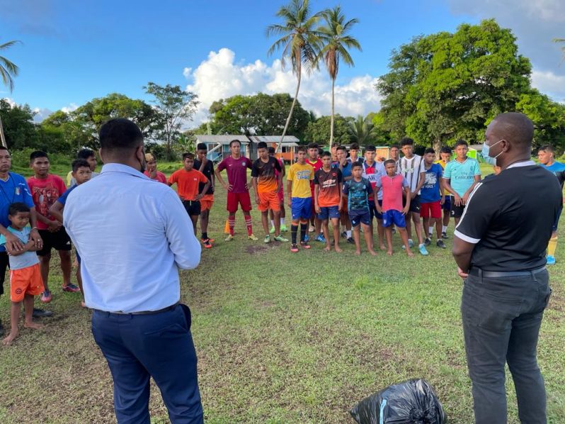 GFF president Wayne Forde (right) addresses the gathering of youth players in Waramadong.