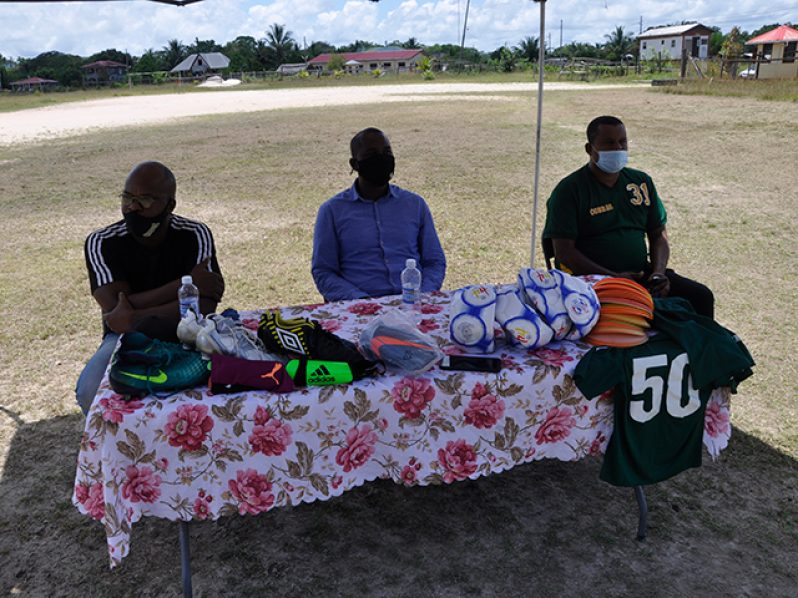GFF president Wayne Forde is flanked by his counterparts from UDFA Terrence Mitchell (left) and Coomacka United Football Club, Renison Rawlins.