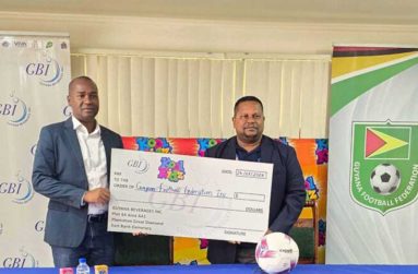 Guyana Football Federation President, Wayne Forde (left) and General Manager for Guyana Beverages Inc., Samuel Arjoon, signify GBI’s support for the event