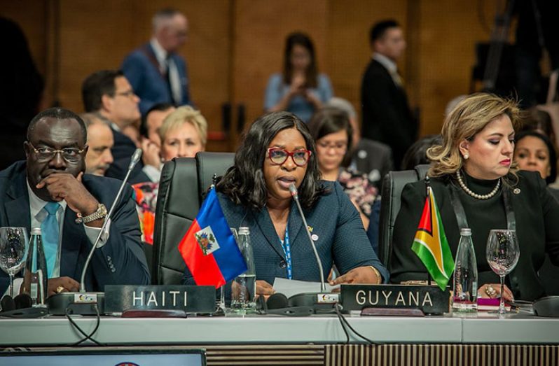 Minister of Foreign Affairs, Dr. Karen Cummings (Centre)