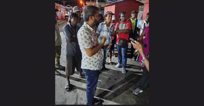 Georgetown Mayor Ubraj Narine pictured last evening engaging persons on New Market Street (Guyana Chronicle photo)
