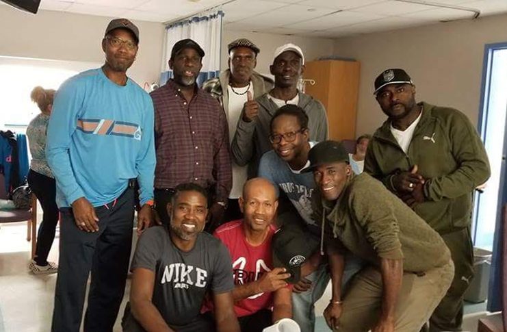 Former national basketball captain, Brusche at left and former national coach, John Davidson second left, former national captain Auric Tappin stooping at left, among other former players after visiting their friend 'Fat' Wayne in hospital last week.