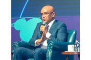 Vice President, Dr Bharrat Jagdeo, engages youths during the student forum on Friday (Japheth Savory photos)