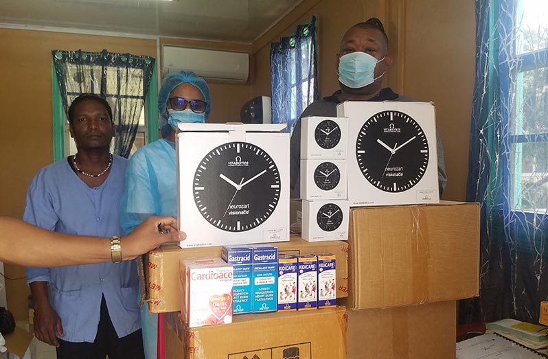 BCB president Hilbert Foster (third from left), hands over donation to the Port Mourant Public Hospital representatives.