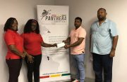 RHTYSC vice-president Mark Papannah receives donation from two representatives of Panthera Solutions while Club Secretary/CEO Hilbert Foster looks on.