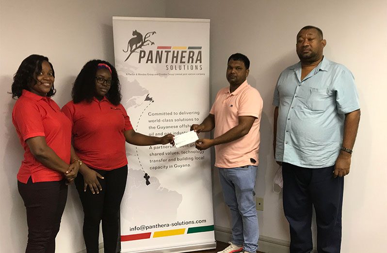 RHTYSC vice-president Mark Papannah receives donation from two representatives of Panthera Solutions while Club Secretary/CEO Hilbert Foster looks on.