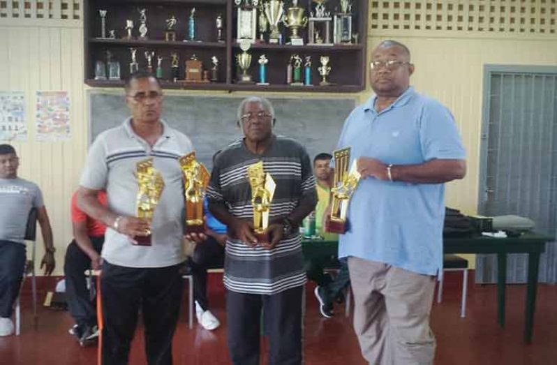 In photo from left: UCCA president Dennis De Andrade, Sydney Jackman and RHTYSC’S Hilbert Foster.