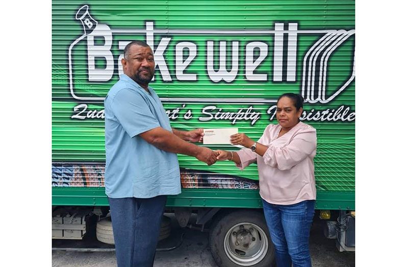 Natasha Bhikari hands over sponsorship to RHTYSC Secretary/CEO Hilbert Foster for 2022