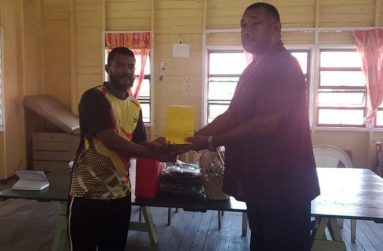 BCB president Hilbert Foster hands over donation to Joel Amsterdam of Mt Sinai CC