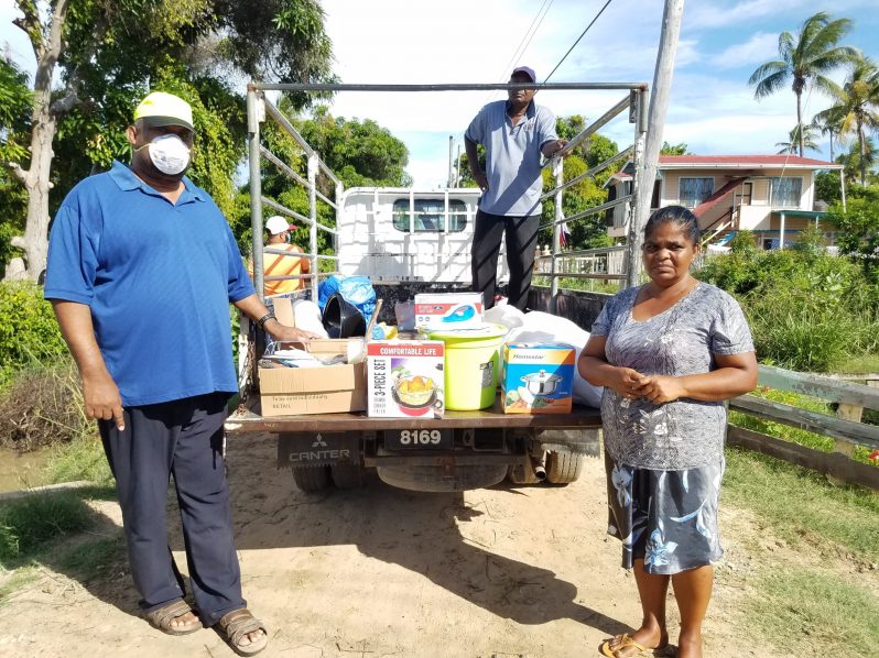 BCB president Hilbert Foster hands over donation to Ms Latchminarine.