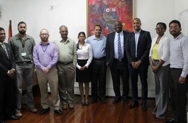 Minister of Culture, Youth and Sport Dr. Frank Anthony (fifth right) and Director of Sport Neil Kumar (fourth left) strike a pose with officials of the GFF’s Normalisation Committee and FIFA officials after the meeting on Monday.