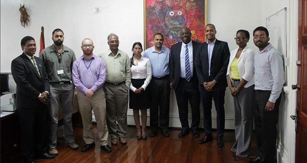 Minister of Culture, Youth and Sport Dr. Frank Anthony (fifth right) and Director of Sport Neil Kumar (fourth left) strike a pose with officials of the GFF’s Normalisation Committee and FIFA officials after the meeting on Monday.