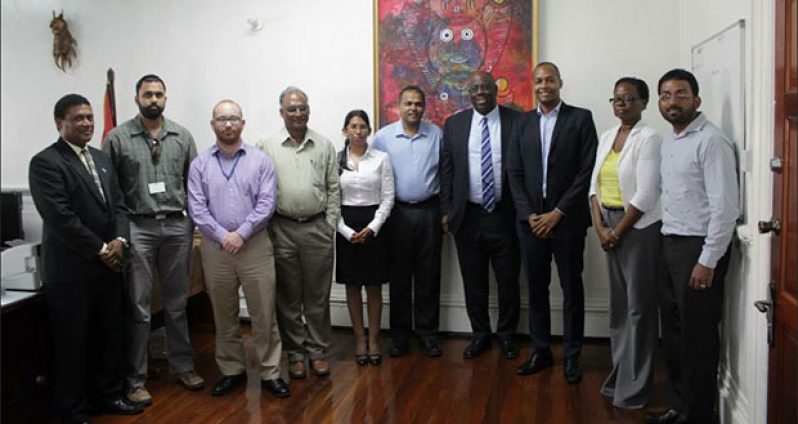Minister of Culture, Youth and Sport Dr. Frank Anthony (fifth right) and Director of Sport Neil Kumar (fourth left) strike a pose with officials of the GFF’s Normalisation Committee and FIFA officials after the meeting on Monday.