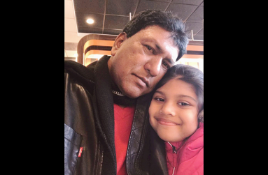 Frederick Rampersaud, with his daughter