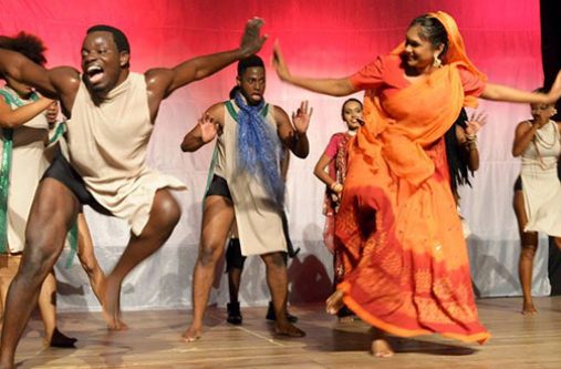 Kijana Lewis (left) and his troupe of dancers depicting interracial unity during one of his performances