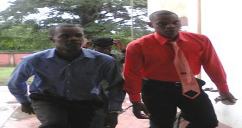 Murder accused Marlon Fordyce (left) and Troy Stewart as they entered the Berbice High Court last Tuesday