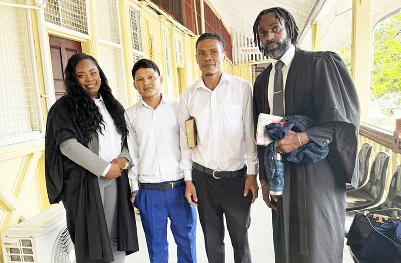 Ewert Calistro and Adolph Joseph are flanked by their attorneys Ronald Daniels and Kiswanna Jefford
