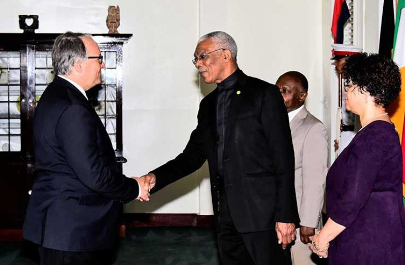 President David Granger shaking hands with the new French Republic Ambassador to Guyana, Mr. Antoine Joly after the accreditation ceremony