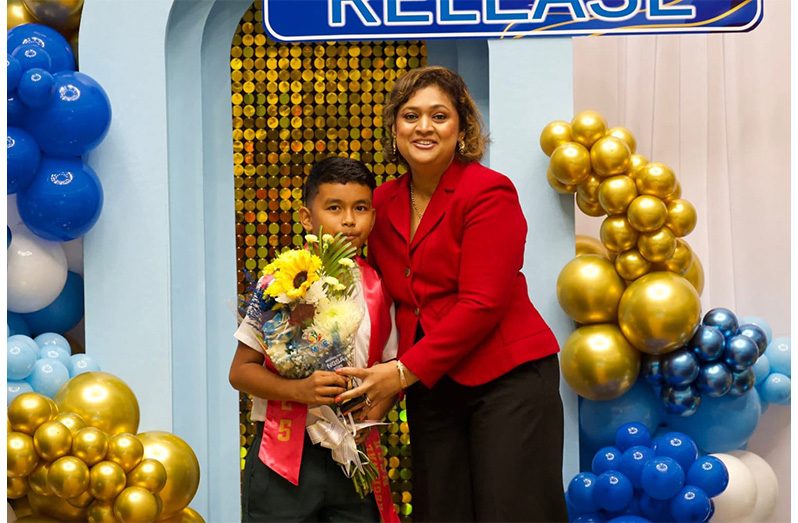 Gustavo alongside Minister of Education Priya Manickchand (Minister of Education photo)