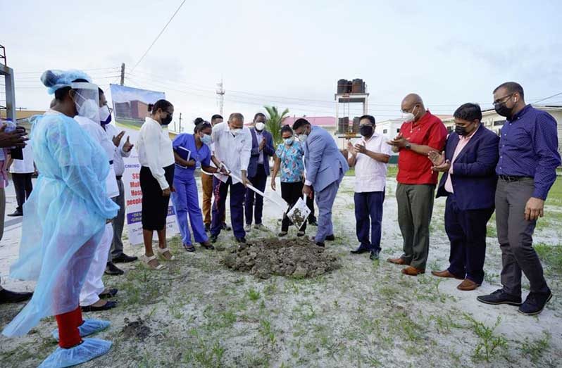 President, Dr. Irfaan Ali, and Minister of Health, Dr. Frank Anthony, turn the sod for the $2 billion ‘multi-specialty’ hospital at Suddie, Region Two (Pomeroon-Supenaam),
as other officials look on (Office of the President photo)