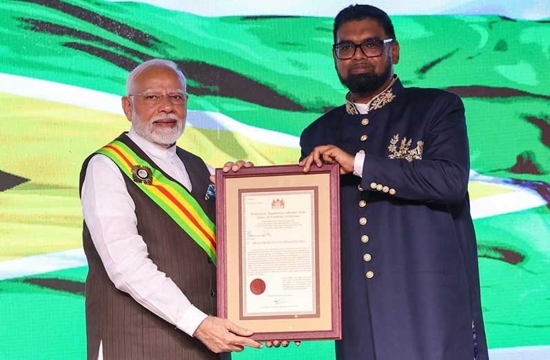 President Dr. Irfaan Ali on Wednesday gave Guyana’s highest national award, the Order of Excellence, to India’s Prime Minister, Shri Narendra Modi. The award is a recognition of his visionary 
leadership. Earlier in the day, PM Modi was presented with a sculpture titled “Pivotal Bond,” created by renowned sculptor Winslow Craig from local silverballi wood. The sculpture celebrates the 
profound cultural and historical ties between India and Guyana, capturing the essence of nationhood through powerful national symbols. Since his arrival on Tuesday night, the Indian Prime Minister 
has held bilateral discussions with President Ali and has engaged CARICOM leaders. He is scheduled to address the National Assembly of Guyana today (Photos: Office of the President and Dr. S. 
Jaishankar)