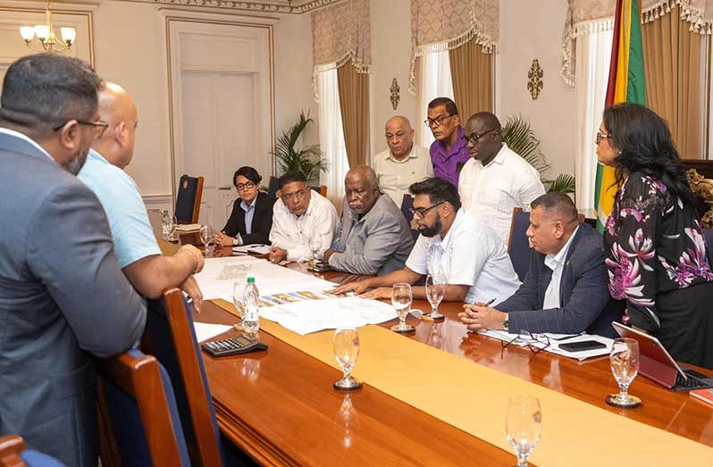 President, Dr. Irfaan Ali, on Monday, unveiled the masterplan for the homestead programme on the Soesdyke-Linden Highway.
 The project, which aims to empower single mothers, will commence shortly. It includes the construction of 500 houses on some 100 acres of land at Yarrowkabra.
 Prime Minister, Brigadier (Ret’d), Mark Phillips; other members of the Cabinet; technical officials and officials from the banking sector were also at the meeting 
(Office of the President photo)