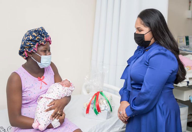 First Lady, Mrs Arya Ali, speaks with first time mother, Tiffany Ann Smith-John, who delivered a baby girl on Christmas morning at the Georgetown Public Hospital (Photo: DPI)