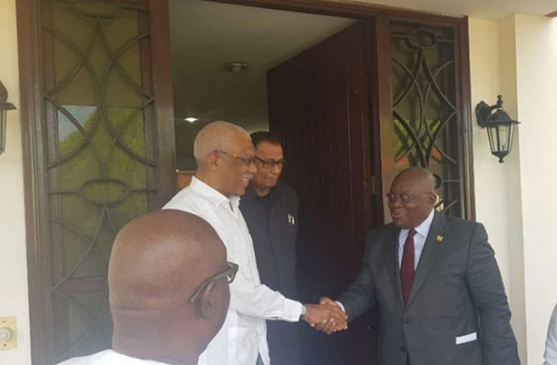 President of Ghana, Nana Addo Dankwa Akufo-Addo
and President David Granger greet each other while
in Cuba earlier this year (Ministry of the Presidency
photograph)