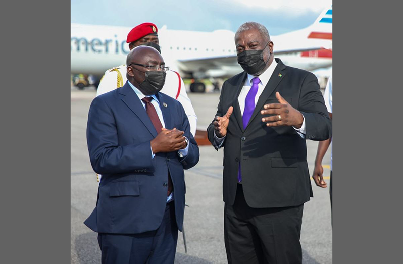 Prime Minister of Guyana Brigadier (Ret’d) Mark Phillips (right), greets Vice-President of Ghana Dr  Mahamudu Bawumia upon his arrival in Guyana on Saturday afternoon. Dr. Bawumia, who is accompanied by an 18-member delegation, will engage high-level Guyanese stakeholders, sign a framework bilateral cooperation agreement and further advance discussions on several areas of mutual interest, all part of efforts to enhance the relationship between the two nations (DPI photo)