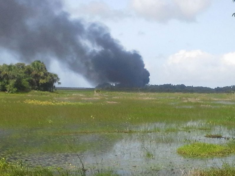 Thick smoke can be seen in the distance overhead Kumaka , Moruca on Saturday afternoon. Photo by Sharon Atkinson