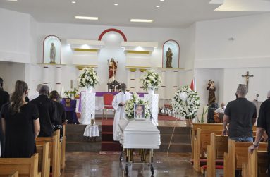 Monsignor Terrence Montrose officiates at the service of celebration for 'Bobby' Fernandes at the Sacred Heart Roman Catholic Church on Monday.