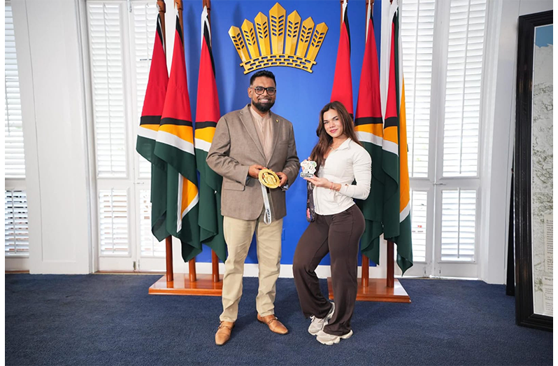 H.E. Dr. Mohamed Irfaan Ali (left) stands with Rosanna Fung