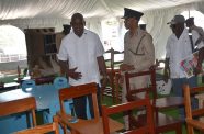 Minister of Home Affairs, Robeson Benn and Director of Prisons, Nicklon Elliot, during their walk through and inspection of furniture made by inmates