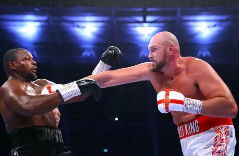 Tyson Fury (right) on the attack against Dillian Whyte.