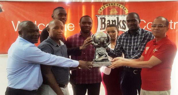 We’re all in! Organisers and sponsors pose at yesterday’s launch of the Banks Beer Inter-Corporation Futsal Tournament.
