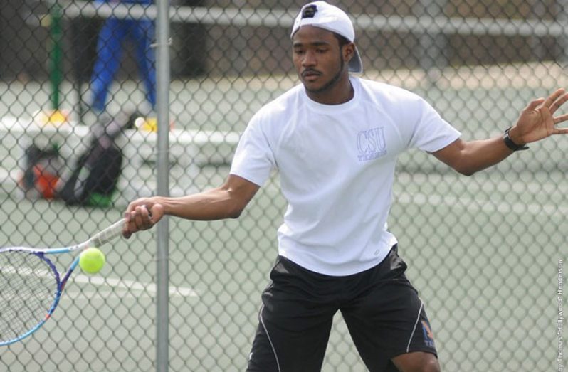 Gavin goes for a groundstrokes during one of his matches representing Coppin State.