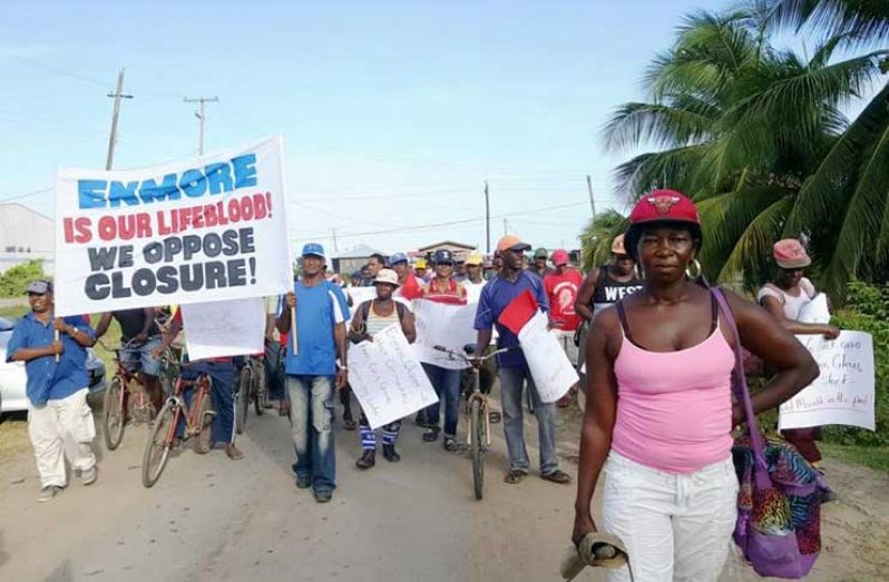 Sugar workers and residents march through the community of Enmore to Enterprise on the East Coast of Demerara during a recent protest against the closure of estates. [GAWU photo]