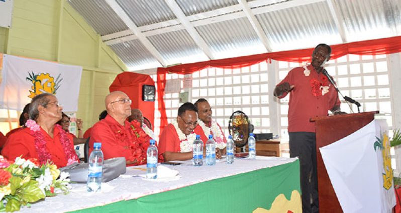 President of the Guyana Trades Union Congress , Lincoln Lewis, makes a point as former President Donald Ramotar , GAWU leader Komal Chand and PPP MP Frank Anthony look on