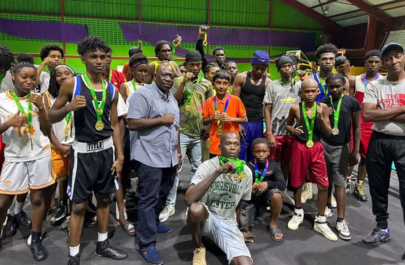 The boxers show off their hardware in the presence of GBA officals and coaches (Sean Devers photo)