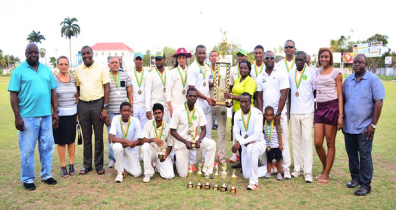 The triumphant DCC team pose with GCA/GISE Trophy Stall and Star Party Rentals First Division two-day cricket trophy. (Samuel Maughn Photo)