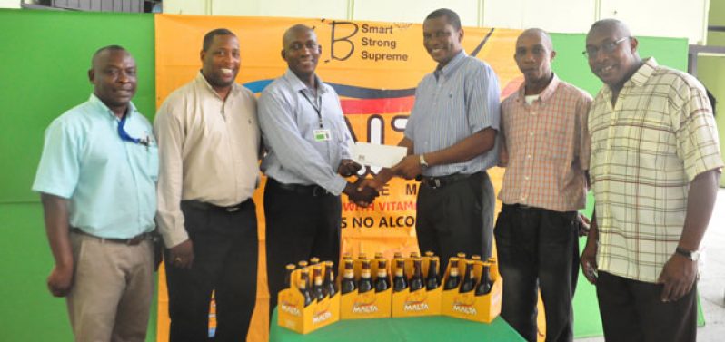 President of the GCA, Roger Harper (third right), collects the sponsorship cheque from Malta Supreme Brand Manager Clayton McKenzie while Shawn Massiah and Mark Harper along with Banks DIH Troy Peters and Mortimer Stewart share the moment.